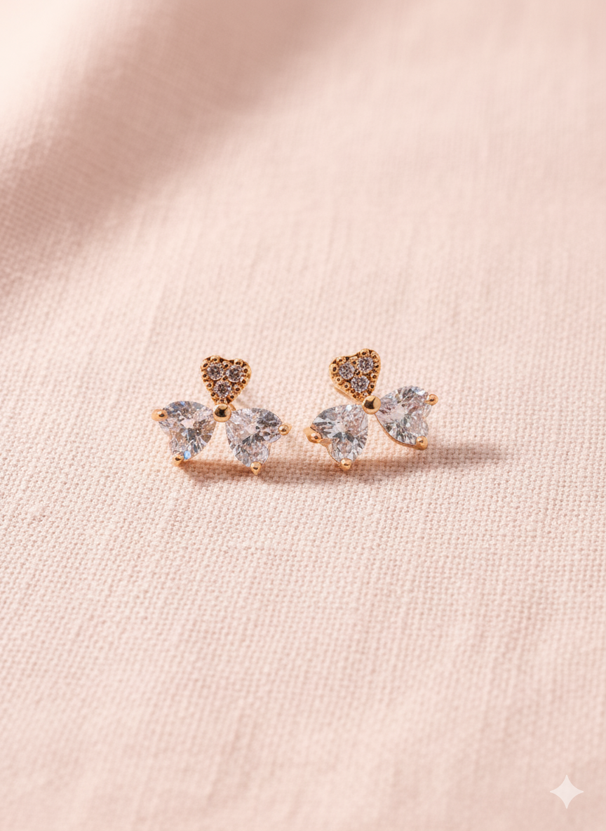 Elegant heart‑cut bow studs that symbolize love and grace