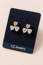Elegant heart‑cut bow studs that symbolize love and grace